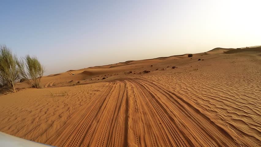 4x4 off road land vehicle taking tourists on desert dune bashing safari, Middle East