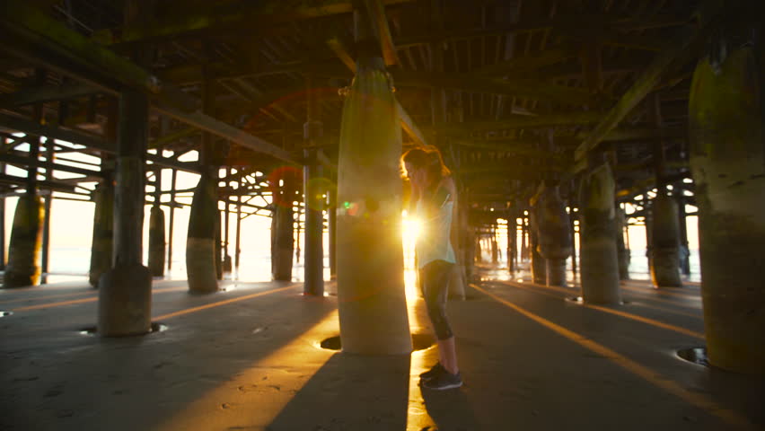 Woman Running on the Beach Under Pier at Sunset. Healthy Active Lifestyle. 4K  | Shutterstock HD Video #15193462