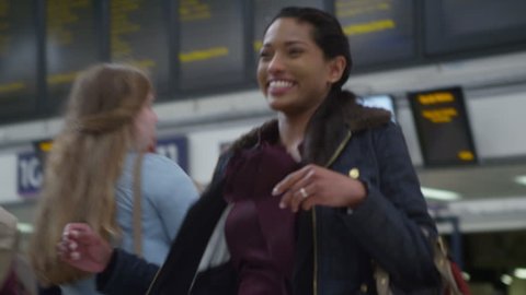 4k, attractive woman rushes to greet her boyfriend at the train station
