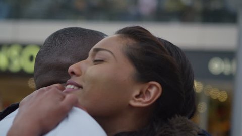 4k Attractive ethnic couple in love, saying goodbye at train station