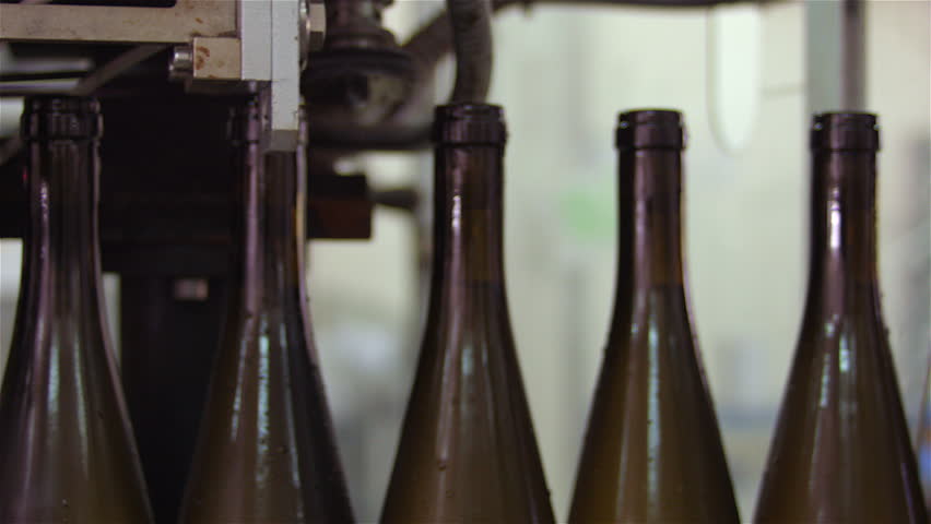 Bottles on a industrial machine. Bottling machine. | Shutterstock HD Video #15205507