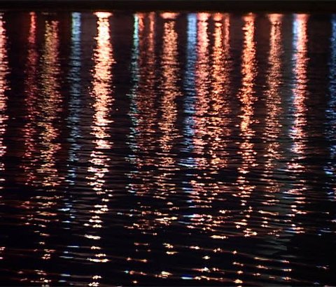 Reflexes of city lights in river"s water 