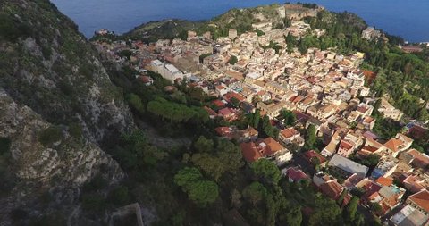Aerial shot of the Taormina, ancient buildings and an amphitheater on the east coast of the island of Sicily, Italy