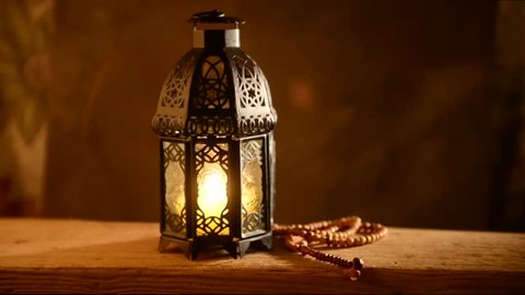 Traditional Ramadan lantern and Islamic rosary. Islamic festive background.