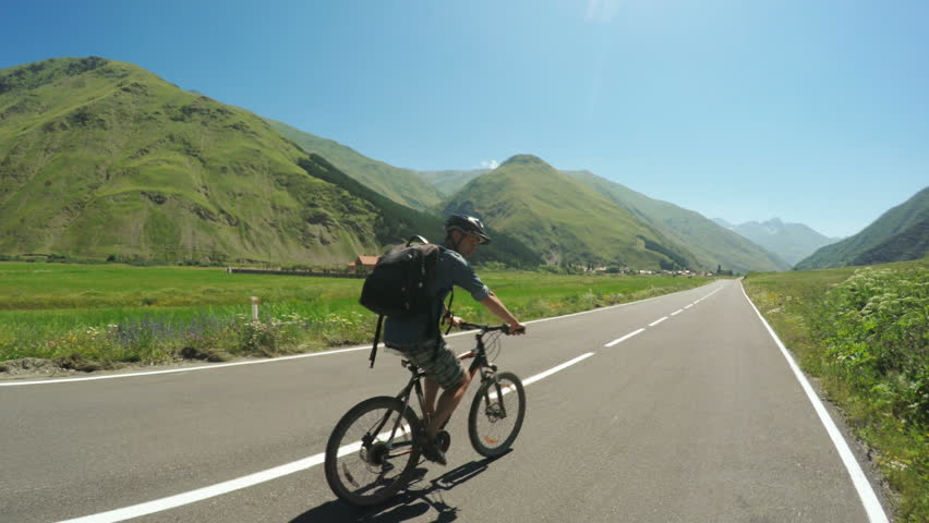 Man on bike in mountains