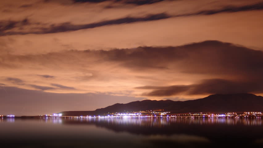 Time lapse of a beautiful sky at with view of lights across the Utah Lake.