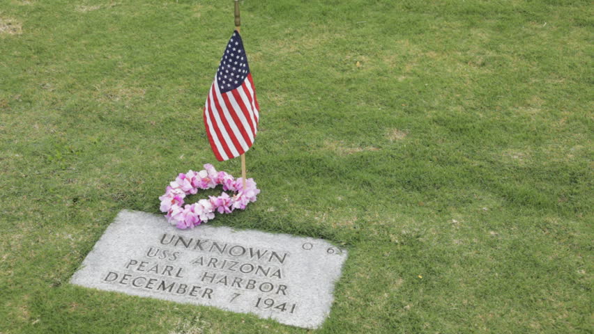 Slow panning clip in Punchbowl National Cemetery of a grave site of an unidentified person who died aboard the USS Arizona during the attack on Pearl Harbor on December 7, 1941.