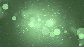 Abstract lights bokeh green background. Moving gloss particles background. Soft beautiful backgrounds. Seamless loop.
