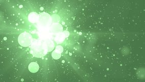 Moving gloss particles on green background. Flood lights disco background with rays and particles. Beautiful disco background. Seamless loop.