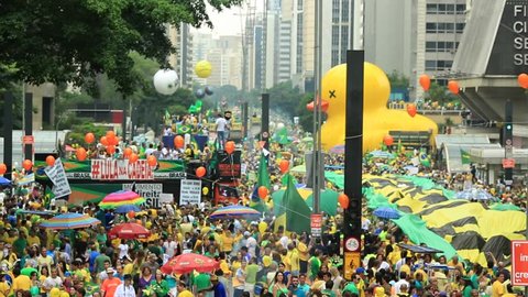 SAO PAULO, BRAZIL - MARCH 13, 2015: Large crowds of people protesting against Brazilian corruption and wanting the impeachment of president Dilma Rousseff and the removal of her political party PT.
