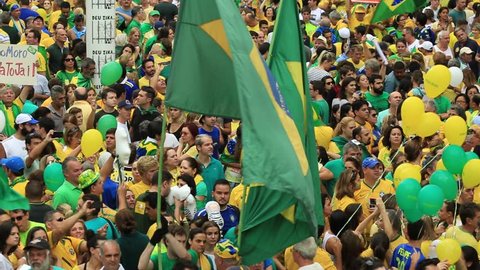 SAO PAULO, BRAZIL - MARCH 13, 2015: Large crowds of people protesting against Brazilian corruption and wanting the impeachment of president Dilma Rousseff and the removal of her political party PT.