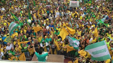 SAO PAULO, BRAZIL - MARCH 13, 2015: Large crowds of people protesting against Brazilian corruption and wanting the impeachment of president Dilma Rousseff and the removal of her political party PT. 4K