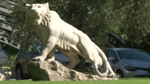 a beautiful marble sculpture of a lion in the garden/ a beautiful marble sculpture of a lion /ROME, ITALY, JUNE 21 2015