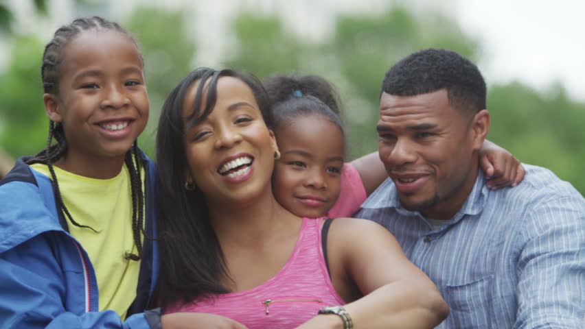 4K Portrait of attractive smiling African American family having fun in the park | Shutterstock HD Video #15243862