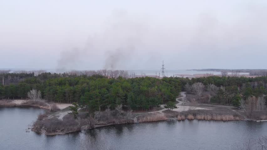 The fire in the forest close up with river.