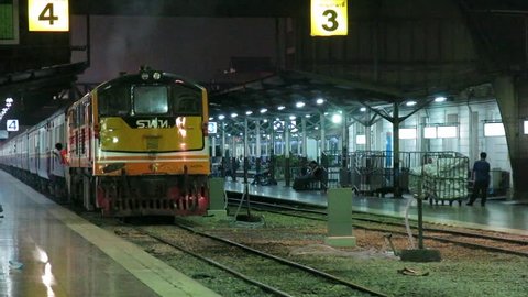 Bangkok, Thailand-February 2, 2015:  diesel engine train departing from Bangkok Train station (Hualampong Station). It is a main train station in Bangkok that people used to travel across the country.