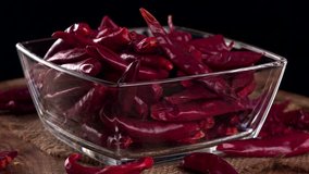 Portion of rotating dried Chillis as not loopable 4K UHD footage
