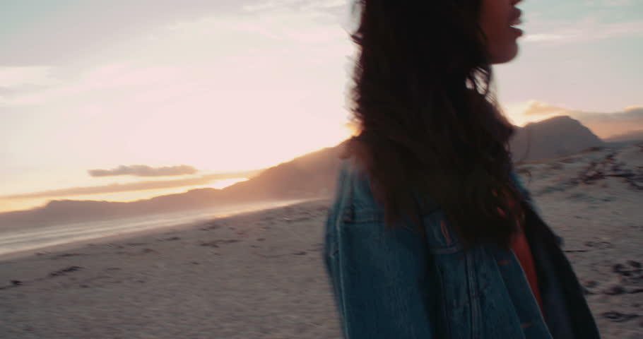 Young adult afro american woman having fun with friends on the beach at sunset | Shutterstock HD Video #15254992