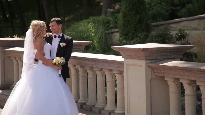 Bride and groom walking in park | Shutterstock HD Video #15273961