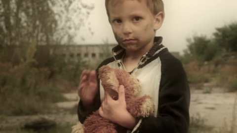 Orphan. Abandoned, lonely child. Ruins in the background. Camera dolly. Canon 7d, HD 1080 25p
Clip ID: boy3_HD