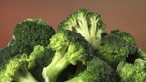 Broccoli Isolated Rotating On Brownorange Background Stock Footage ...