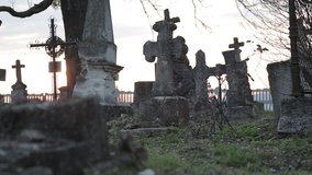 It is very old cemetery. There are many graves from 16 to 21 centuries. It was shot just before sunset therefore some lightflares are very real. Full HD video shot with Canon 6d 25fps and slider.