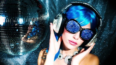 4k stunning sexy disco woman with bling crystal covered headphones surrounded by disco balls