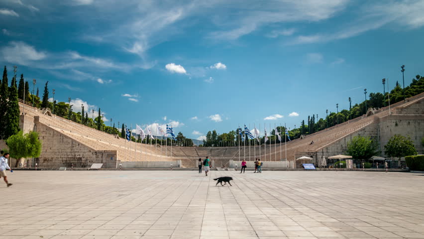 The ancient Panathenaic stadium, located in central Athens, Greece. Time lapse video. White clouds move across the blue sky.