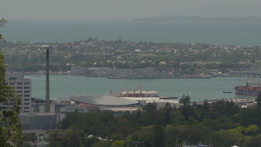 Auckland, New-Zealand - CIRCA December 2013: Coastal view of islands on the water with lots houses and buildings. Mountain in the background.   