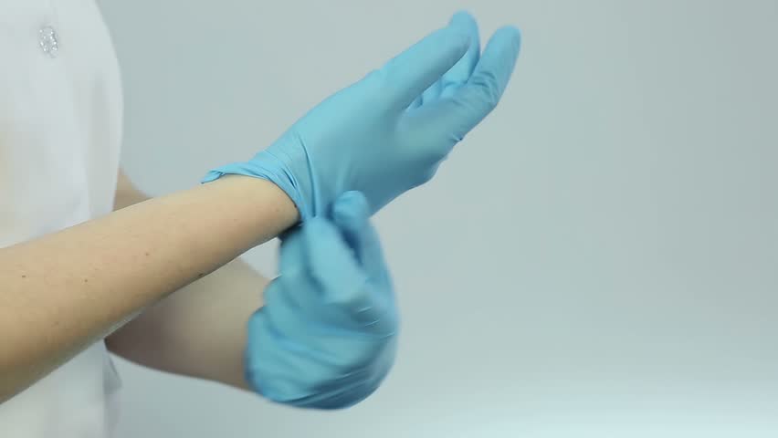 nurse wearing medical gloves before treatment Stock Footage Video (100%