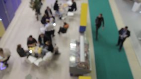 Business people at the trade fair, intentionally blurred background