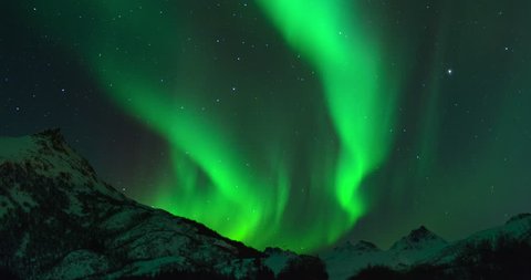 Time lapse clip of Polar Light or Northern Light (Aurora Borealis) in the night sky over the Lofoten islands in Norway in winter.
