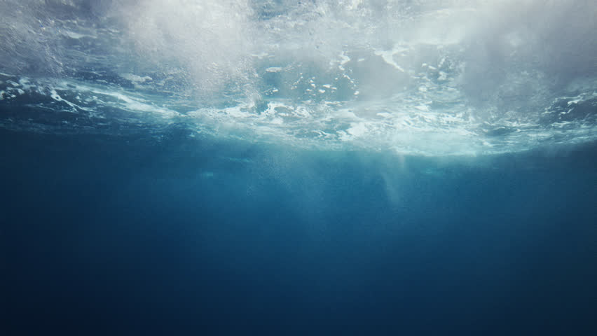 Beautiful underwater sea scene view with natural light rays, shining through the water's glittering and moving surface, caustics, bubbles, and foam, perfect for background and digital composition Royalty-Free Stock Footage #15307069