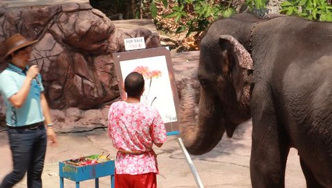 BANGKOK, THAILAND - March 8: Artistic Elephant drawing a picture in elephant show at Safari world March 8, 2016 in Bangkok, Thailand.