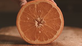 Cutting Half Oranges on Wooden Cut Boards of the Orange, Round Slices, Fresh Fruit, Cut With a Knife, Close-Up of an Orange, Orange, Healthy Lifestyle