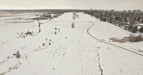 Aerial view of school sport fields and residential area in the Winter. Vídeo Stock