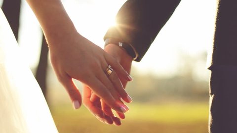 Marry Me Today And Everyday. Newlywed Couple Holding Hands, Shot In Slow Motion Bridesmaid, closeup, hand, male, together, wedding rings, people, married, bridal, Ring hand, closeup, outdoors, bouquet