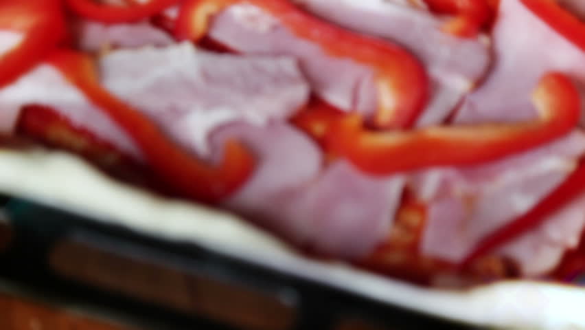 Putting tomatoes on bacon pizza, tilt