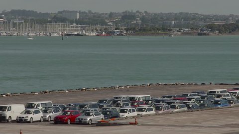 Auckland, New-Zealand - CIRCA December 2013: View of harbour's parking lot with the marina in the background