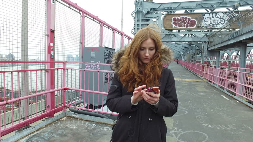 Young adult woman walking on street in New York