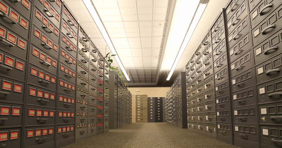 Tracking shot by old filing cabinets in a library. / Pittsburgh, PA - USA, May, 2015