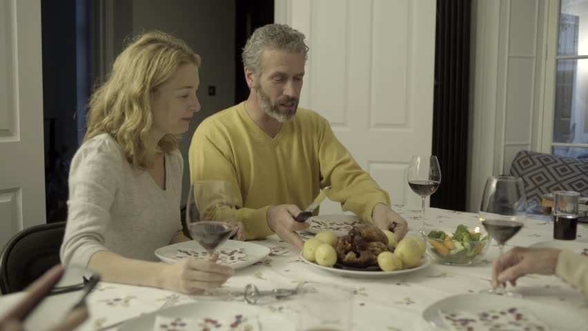 Multi generation family together for meal at home