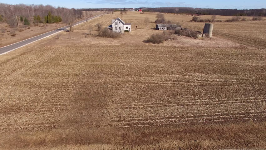 Aerial Flyover of abandoned homestead farm in scenic rural Wisconsin.