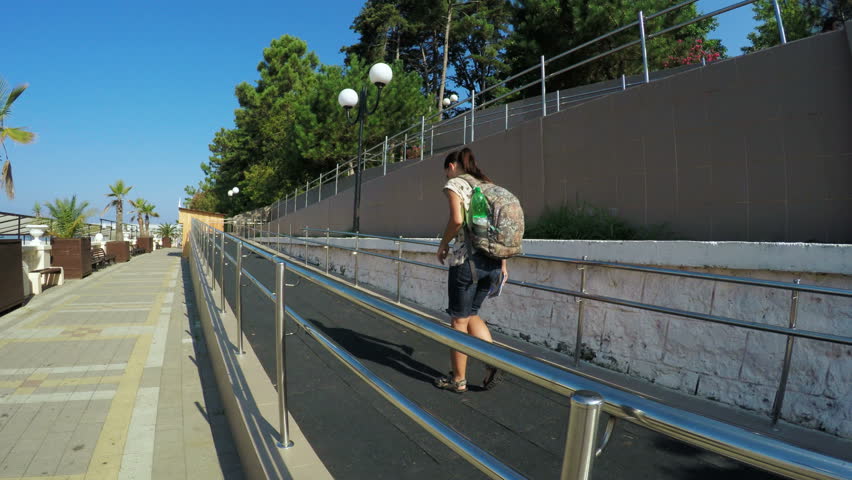 Girl tourist on waterfront