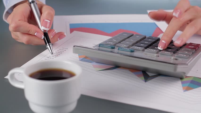 Secretary is tired to work. Coffee break for the accountant. Business woman drinking coffee while working in ofice.