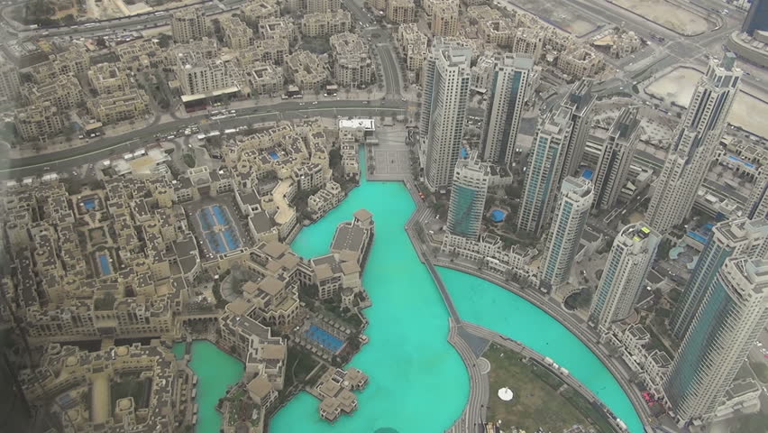 DUBAI, UNITED ARAB EMIRATES - MARCH 7, 2016: Aerial view of Downtown Dubai with Dubai Fountain and skyscrapers from the tallest building in the world, Burj Khalifa | Shutterstock HD Video #15369532