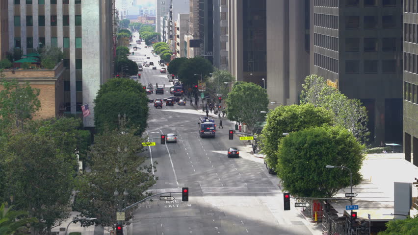 Zoom out shot of Flower Street in downtown Los Angeles in the daytime