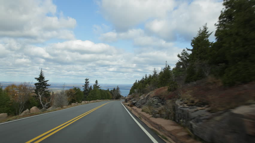 Driving on Cadillac Summit Road (part of the Park Loop Road) in autumn in Acadia National Park, Maine, USA.