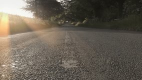 Traveling Down An English Countryside Road At Sunset