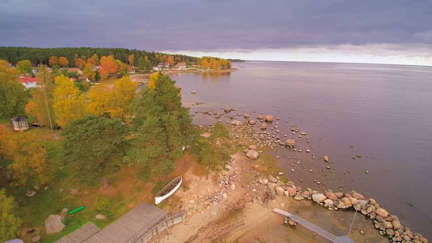 The view of the Kasmu village in aerial view. Trees surrounding the houses that is fronting the big ocean in Kasmu which is a part of the Lahemaa National park